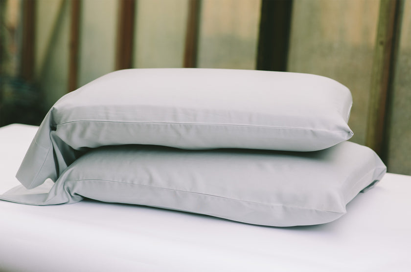 the Tencel Pewter Grey Pillowcases on two pillows