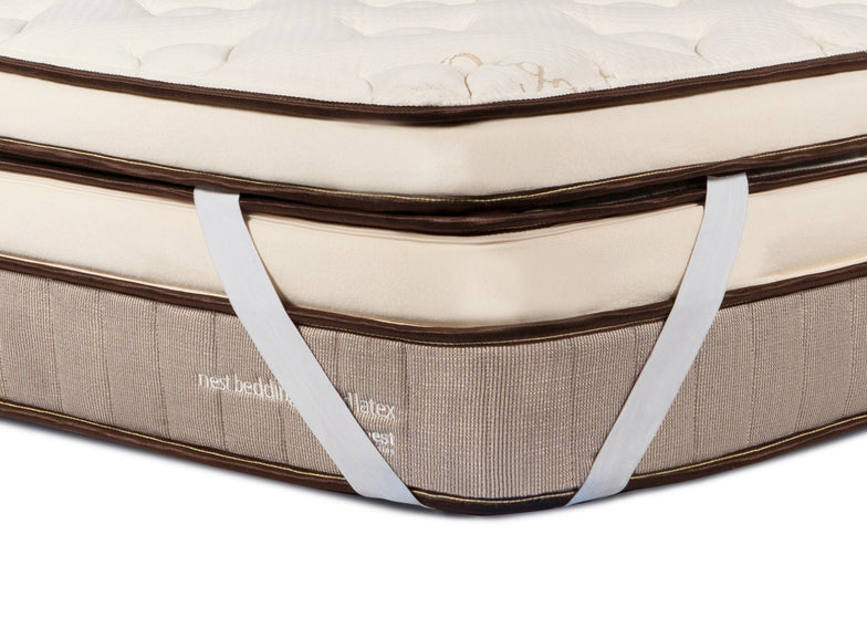 Soft Latex Topper corner strap wrapped around the Owl Natural Hybrid mattress