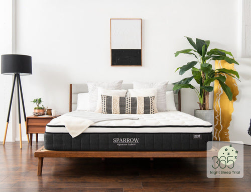 sparrow mattress sitting on bamboo bed frame in bedroom with 365 sleep trial badge